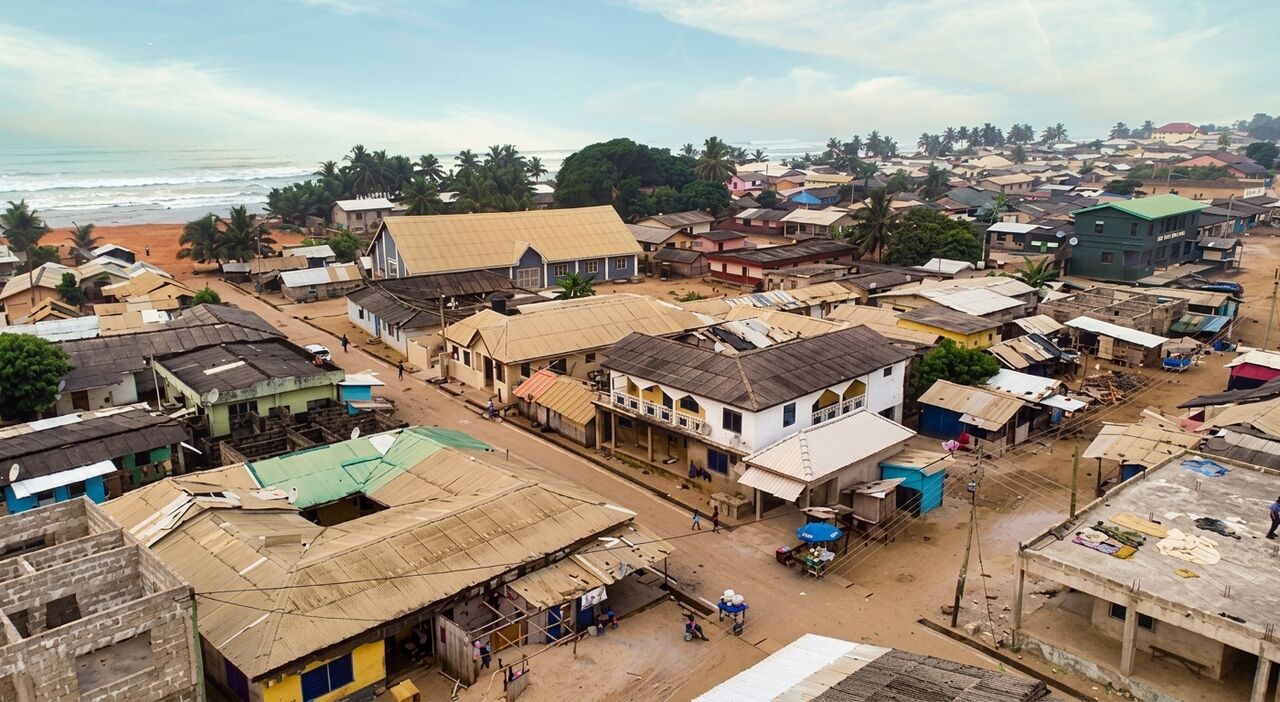 Aerial view of Esiama — town, ocean and coastline